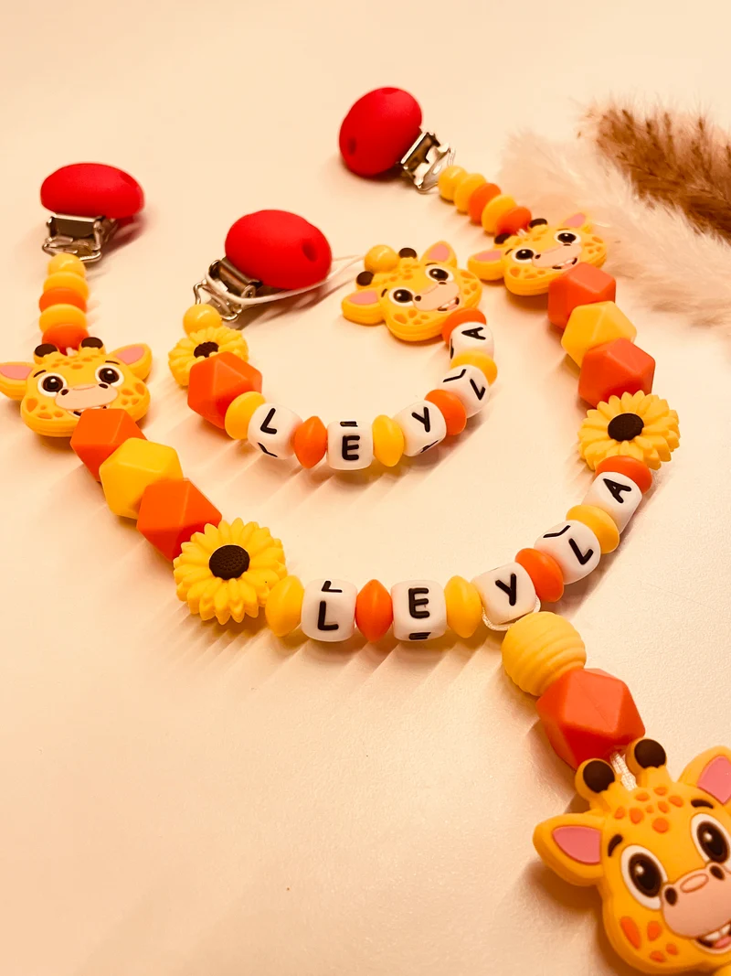 Schnullerkette, Kinderwagenkette Giraffe Blume gelb orange rot
