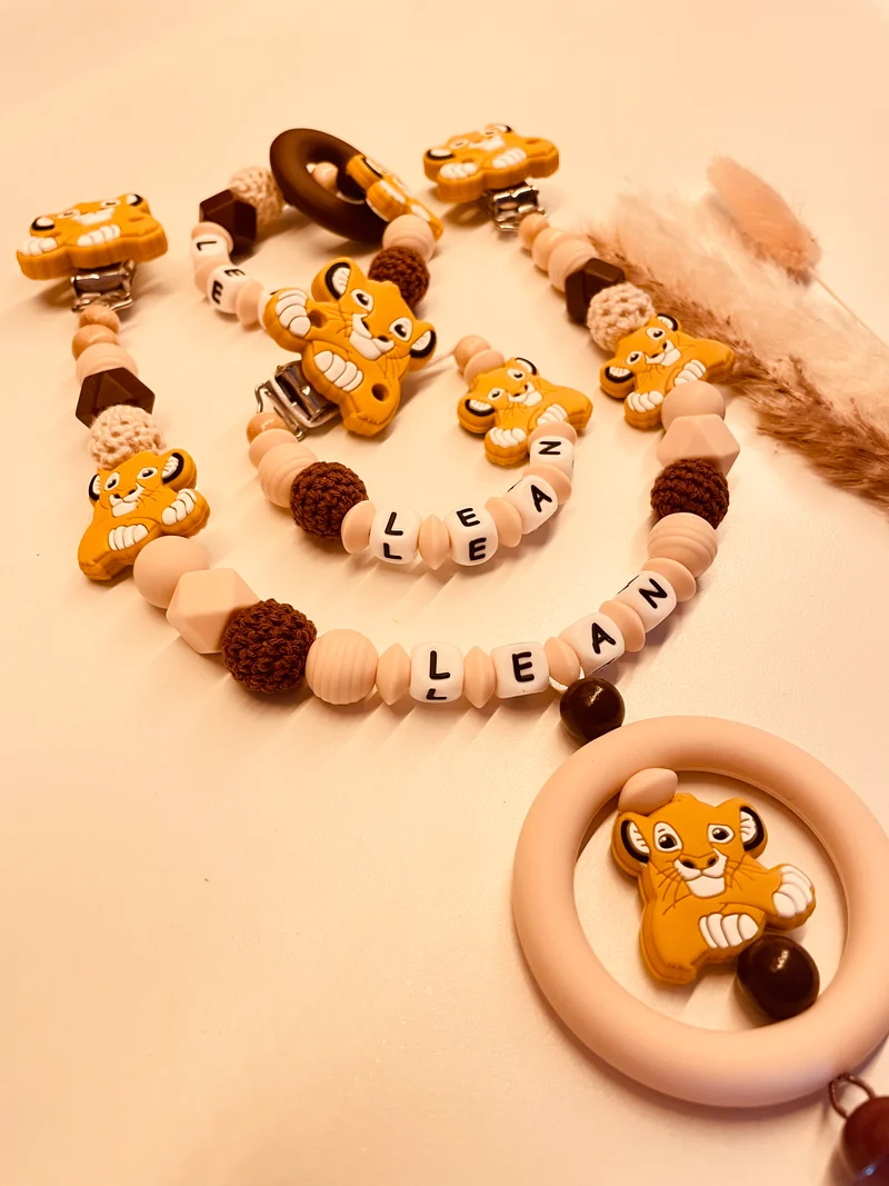 Schnullerkette, Kinderwagenkette, Greifring Löwe beige braun