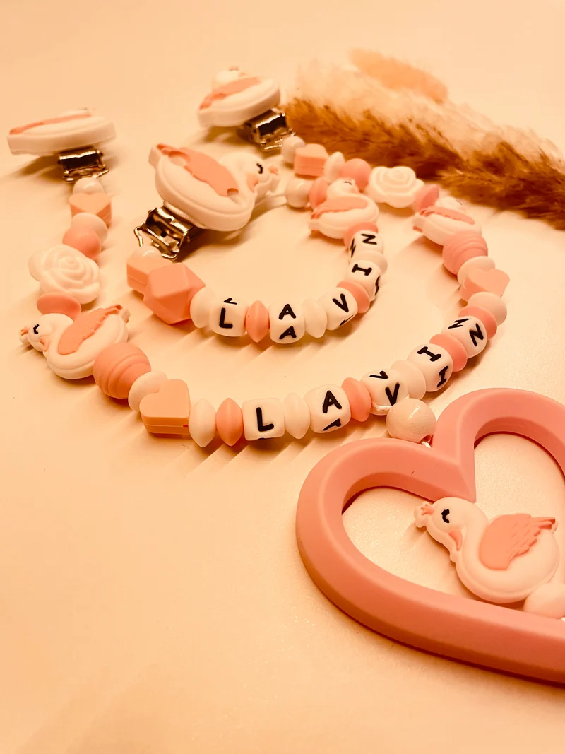 Schnullerkette, Kinderwagenkette Schwan rosa weiß