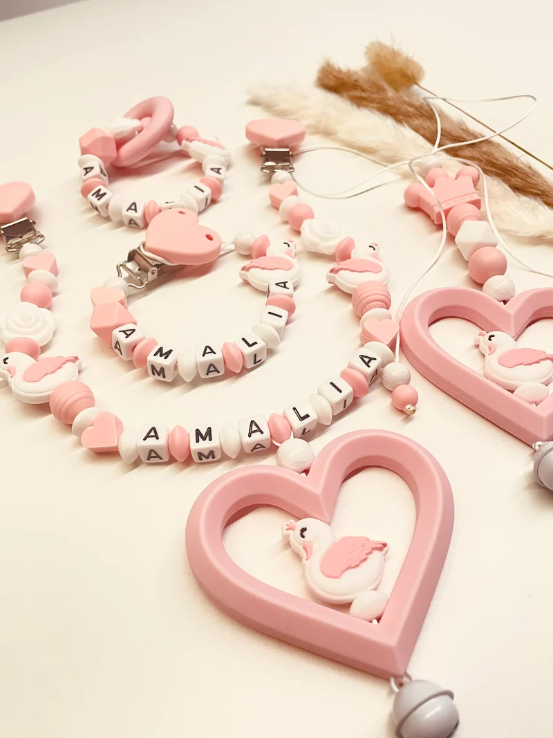 Schnullerkette, Kinderwagenkette, Greifring, Babyschalenanhänger Schwan rosa weiß
