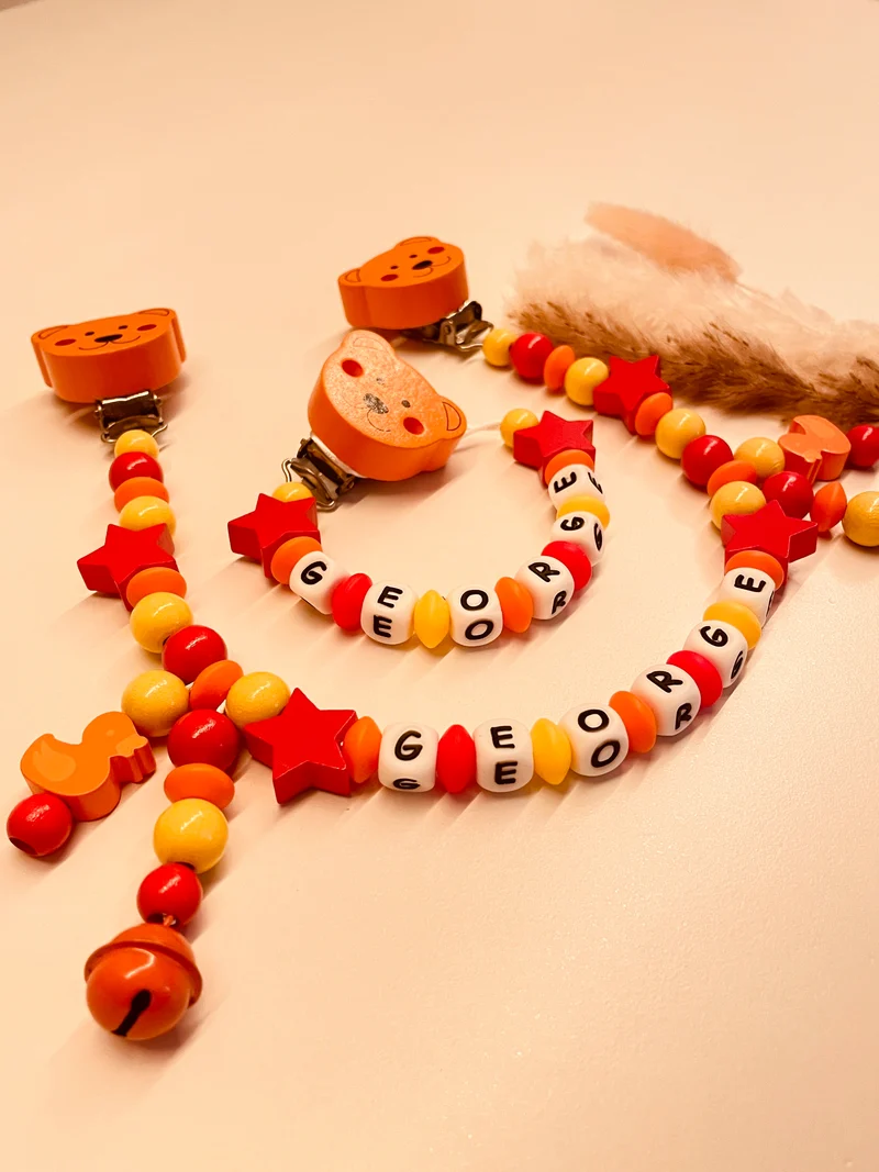 Schnullerkette Kinderwagenkette personalisiert Bär mit Stern gelb orange rot