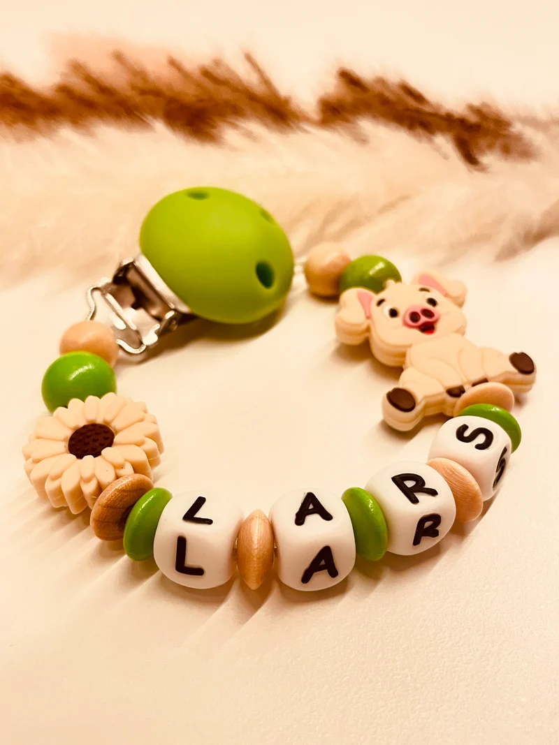 Schnullerkette Schwein Blume grün beige