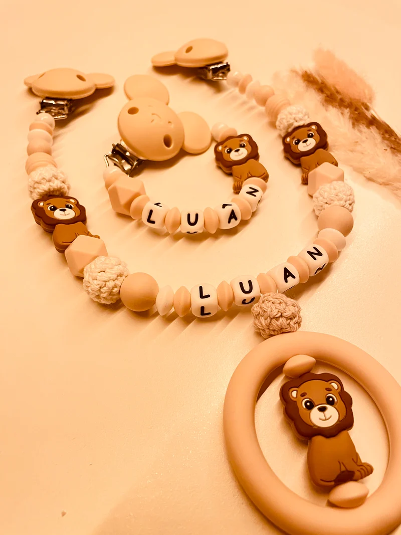 Schnullerkette, Kinderwagenkette personalisiert Löwe beige
