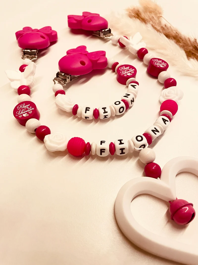 Schnullerkette, Kinderwagenkette kleine Schwester pink weiß