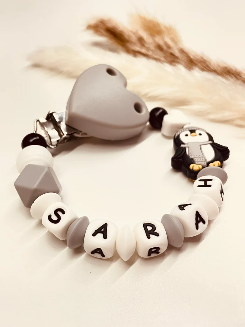Schnullerkette Pinguin grau-weiß